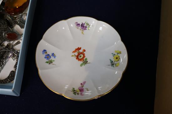 A Meissen flower encrusted cup and saucer